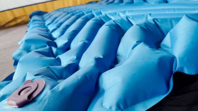 This is a picture showing that the FlatValves (deflation valve pictured) of the Klymit Double V Uninsulated Sleeping Pad are low profile.