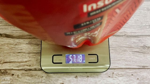 This is a picture of me weighing the Klymit Insulated Double V with its stuff sack (57.2 ounces).