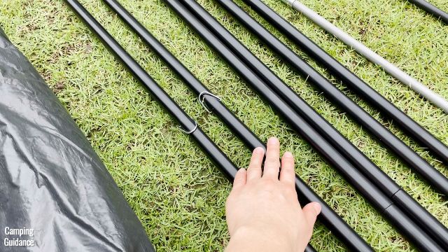 This is a picture of me touching the 2 middle steel poles that have the "D" rings.