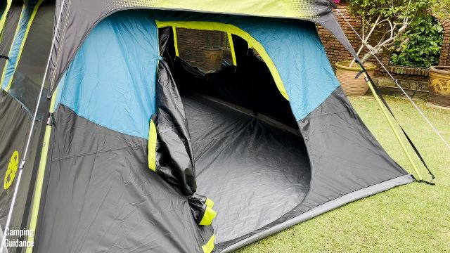 This is a picture of the back door of the Coleman 10-Person Instant Cabin Tent, that I’ve left open in this picture.
