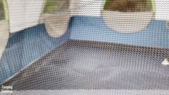 This is a picture of the bug net of one of the windows in the Ozark Trail 10-Person Cabin Tent.