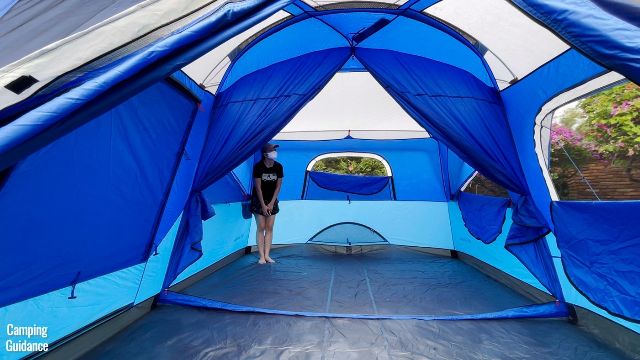 This is a picture of me standing in the corner of the Columbia Mammoth Creek 10-Person Tent.