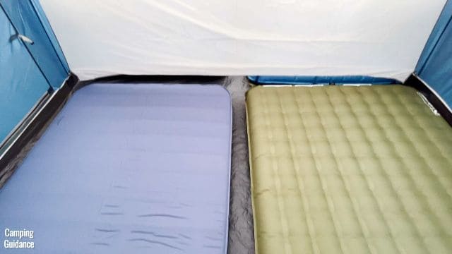 This is a picture of 2 queen-sized camping mattresses on one side of the divider of the Ozark Trail 10-Person Cabin Tent.