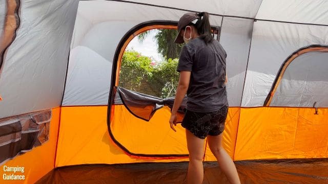 This is a picture of me having unzipped the mesh panel of the door of the Core 10-Person Straight Wall Cabin Tent.