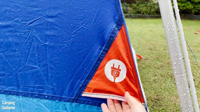 This is a picture of me touching the e-port of the Columbia Mammoth Creek 10-Person Tent.