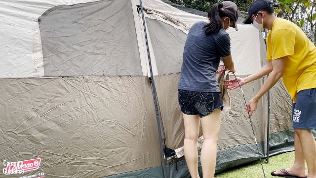 This is a picture of my brother and I curving one of the hinged door fiberglass poles into place for the WeatherMaster 10.