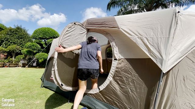 This is a picture of me ducking to get through the hinged D-door of the WeatherMaster 10-Person Tent.
