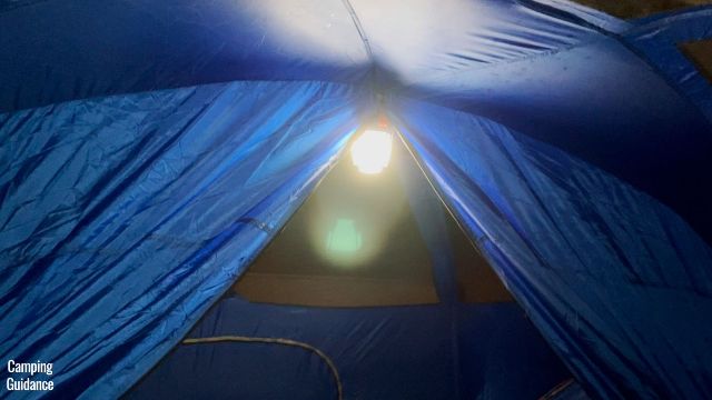 This is a picture of me using my Black Diamond Apollo lantern on one of the lantern loops of the Columbia Mammoth Creek 10-Person Tent.