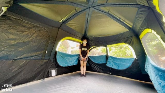 This is a picture of me standing in the corner of the Coleman 10-Person Instant Cabin Tent.