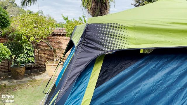 The 4 corners of the rainfly of the Coleman 10-Person Instant Tent are black in color for easy identification.