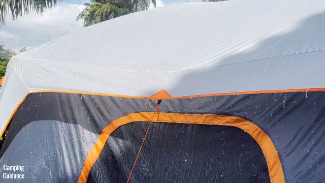 This picture shows water dripping off the rainfly of the Core 10-Person Straight Wall Cabin Tent.