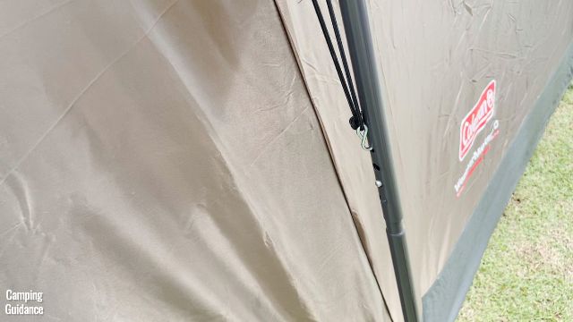 This is a picture of the S-hook of the Coleman WeatherMaster 10-Person Tent's rainfly, secured to a hole in the nearest steel pole.