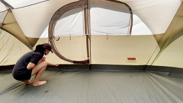 This is a picture of me touching the damp seam that the water was leaking through during my rain test of the WeatherMaster 10-Person Tent.