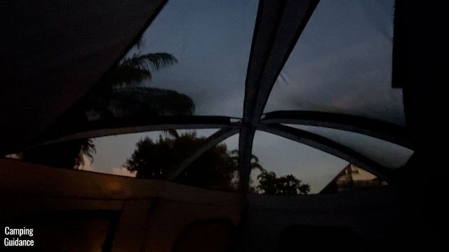 This is a picture of the ceiling mesh (without the rainfly) of the Core 10-Person Straight Wall Cabin Tent at night for stargazing.