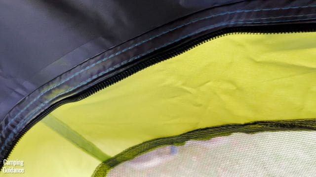 This is a picture of the stitching above one of the windows of the Coleman 10-Person Instant Cabin Tent.