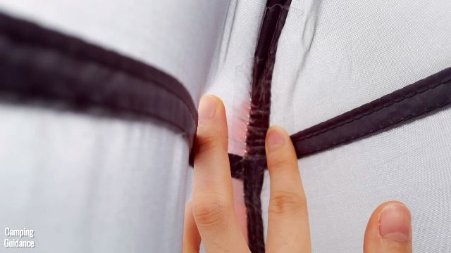 This is a picture of where the guylines have been stitched to the main tent body of the Core 10-Person Straight Wall Cabin Tent.