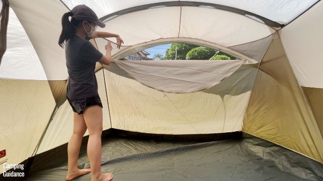 This is a picture of me sticking my hand into one of the pockets of the Coleman WeatherMaster 10-Person Tent.
