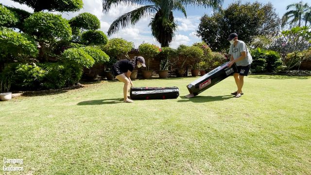 This is a picture of my brother and I unboxing the Coleman 10-Person Instant Cabin Tent.