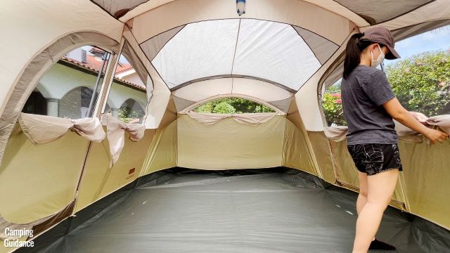 This is a picture of me opening up 5 windows in the Coleman WeatherMaster 10-Person Tent.