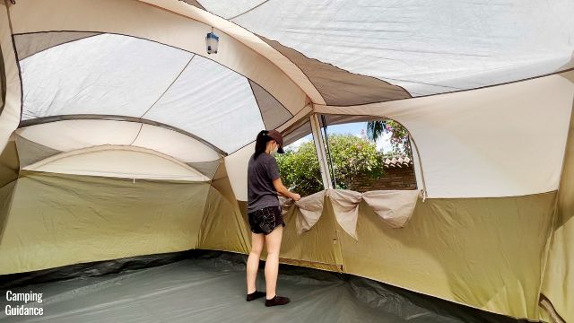 This is a picture of me opening up the 2 windows on the length of the WeatherMaster 10-Person Tent.