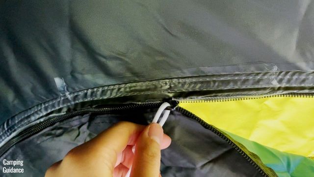 This is a picture of one of the window zippers in the Coleman 10-Person Instant Cabin Tent, which snags into the seam tape.