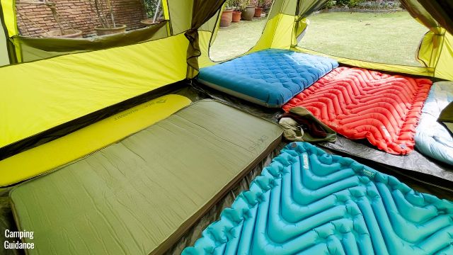 This is a picture of my Outdoor Products 10-Person Instant Cabin Tent with 10 sleeping pads (a mix of 2 single, 3 double sleeping pads, and 1 full mattress) inside the tent.