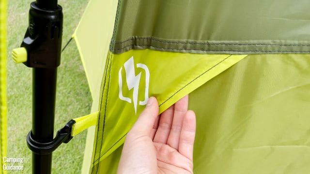 This is a picture of me touching the e-port at the middle of the Outdoor Products 10-Person Instant Cabin Tent.