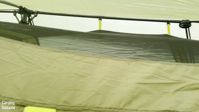 This is a picture of one of the pre-attached poles of the Outdoor Products 10-Person Instant Cabin Tent. You can also see 2 of the hubs, and 2 of the pre-attached pole clips.