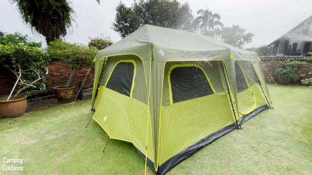 This is what it looks like when water hits the rainfly of the Outdoor Products 10-Person Instant Cabin Tent. Notice that the rainfly is quite a distance away from the tent body, so water avoids most of the mesh.