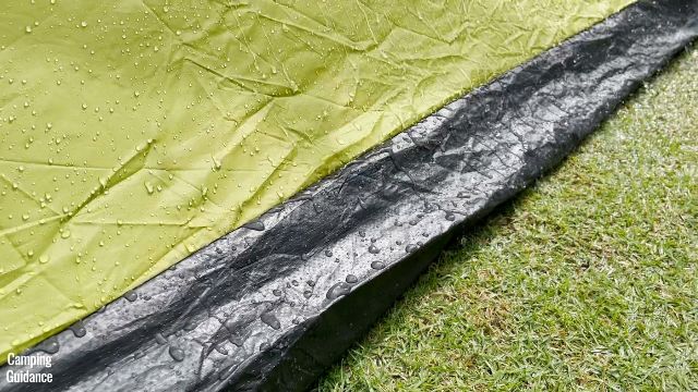 This is the seam connecting the yellow fabric of the Outdoor Products 10-Person Tent body to the bathtub flooring.