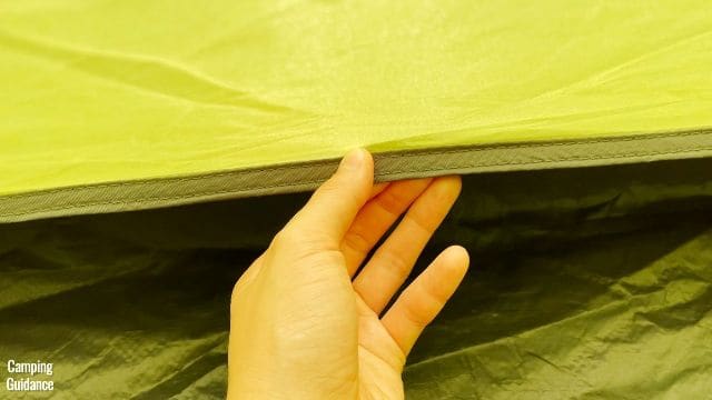 This is a picture of me holding the inverted seam in the Outdoor Products 10-Person Tent.