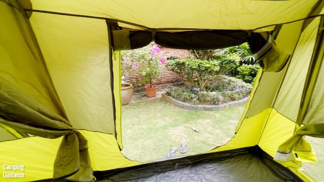 This is a picture of what the side door in the Outdoor Products 10-Person Instant Cabin Tent looks like when it's fully open and clipped up.