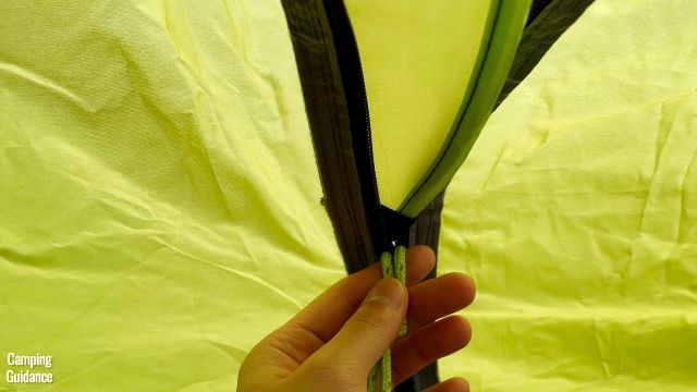 This is a picture of my side door zipper snagging on the outside rain cover of the Outdoor Products 10-Person Instant Cabin Tent.