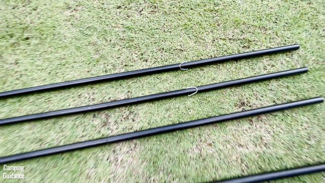 This is a picture of the steel poles of the Ozark Trail 10-Person Cabin Tent. 2 of the poles have these silver hooks at the top of the poles.