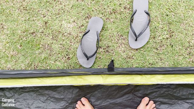 This is a picture of my slippers exposed to the rain outside the Outdoor Products 10-Person Instant Cabin Tent, because there's no vestibule.
