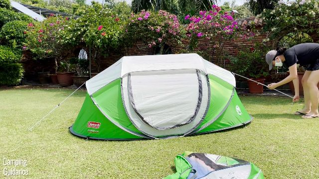 This is a picture of me guying out my Coleman 2-Person Pop Up Tent with the 2 pre-attached guylines.