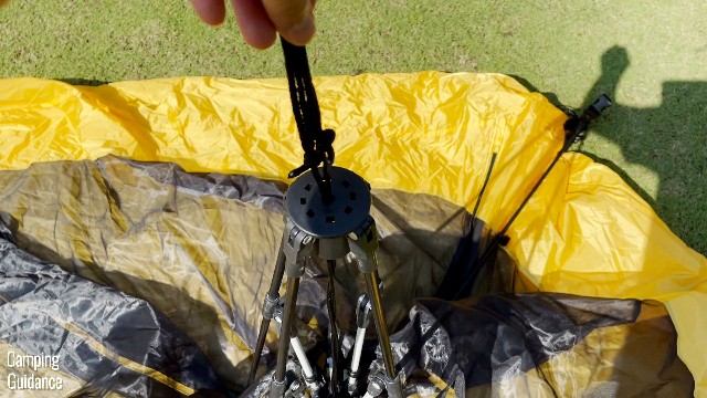 This is a picture of the top of the central hub of the Teton Sports 2-Person Vista Quick Tent. It comes with drawstrings for you to grab onto with one hand (like I’m doing in the picture).
