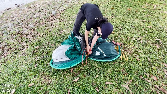 When folding the Quechua 2 Seconds Pop Up Tent up, it will form this figure-8 shape, which you will then need to fold further in half.