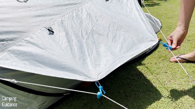 This is a picture of me hooking up the S-hooks of the side vent of the Quechua 2 Seconds Fresh and Black Tent.