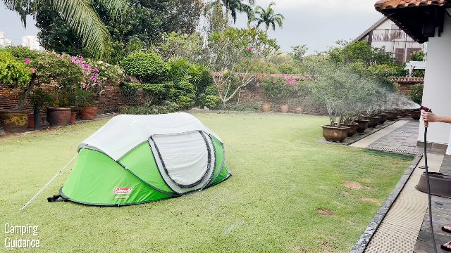 This is a picture of me using a water hose to spray water on my Coleman Pop Up 2.