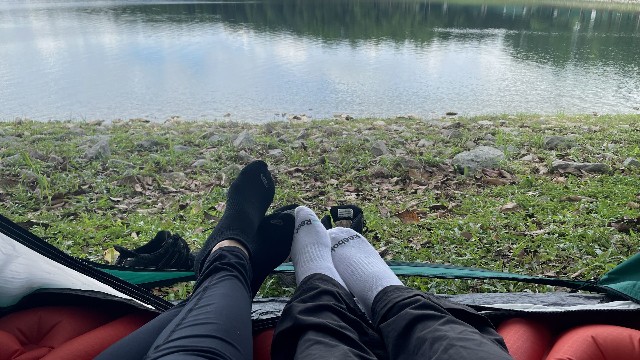 This is a picture of my friend and I in my Quechua 2 Seconds Tent in front of a lake.