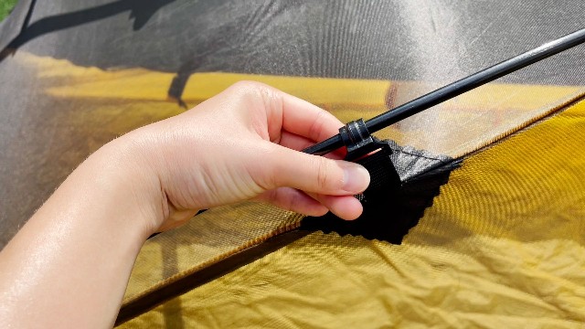This is a picture of me touching one of the pole clips of the Teton Sports 1-Person Vista Quick Tent.