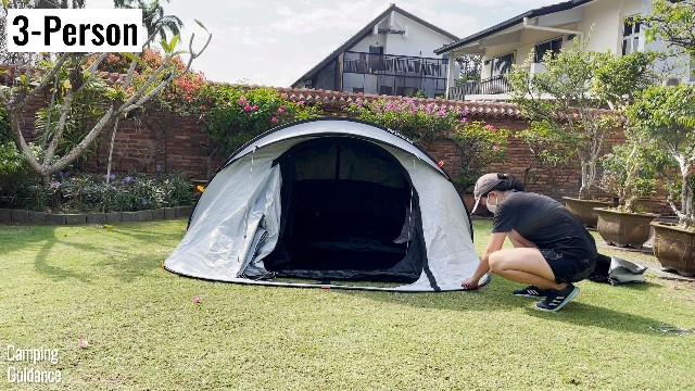 This is a picture of me setting up my Quechua 2 Seconds Fresh and Black 3-Person Tent.