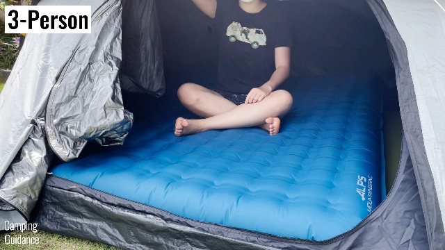 This is a picture of me sitting on a 6-inch Queen airbed inside my Quechua 2 Seconds Fresh and Black 3-Person Tent.