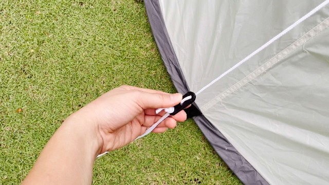 This is what the pre-attached tensioner of the Coleman 4-Person Pop Up Tent looks like.