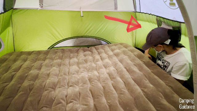 This is a picture of me squashed to the side of the tent when inflating a queen mattress inside my Coleman 2-Person Sundome Tent.