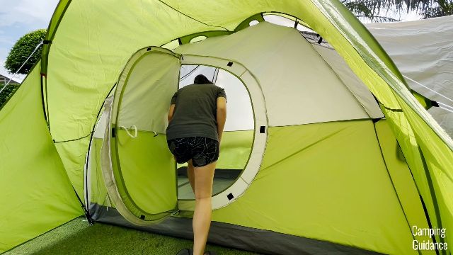 This is a picture of me ducking to get through the hinged door of the Coleman Montana 8-Person Tent.