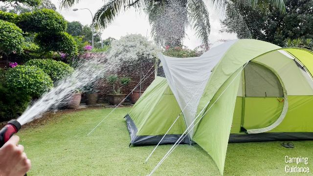 This is a picture of me using a water hose to hose down the Coleman Montana 8-Person Tent.