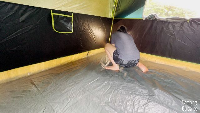 This is a picture of me checking on any potential leaks in the Coleman Sundome Dark Room Tent.