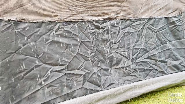 Water running over the black fabric of the Coleman Instant Tent 4.